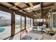 Enclosed sunroom with ceiling fan and skylights overlooking the backyard at 4476 Oakhill Cir, Las Vegas, NV 89121
