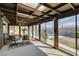 Enclosed sunroom with ceiling fan and skylights overlooking the pool and patio at 4476 Oakhill Cir, Las Vegas, NV 89121