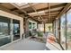 Enclosed sunroom with ceiling fan and skylights overlooking the pool and backyard at 4476 Oakhill Cir, Las Vegas, NV 89121
