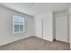 Bedroom featuring carpet, white walls, natural lighting from window, and closet with sliding doors at 4561 Woolcomber St, Las Vegas, NV 89115