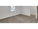 Bedroom showcasing carpet and a window; neutral walls complement the space at 4561 Woolcomber St, Las Vegas, NV 89115