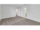 Spacious bedroom with carpeted floors, multiple closets, and neutral wall colors at 4561 Woolcomber St, Las Vegas, NV 89115