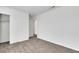 Bedroom featuring carpet, white walls, large closet, and an open entry to another room at 4561 Woolcomber St, Las Vegas, NV 89115