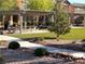 Community space with gravel path, artificial turf, shade structures, and landscaping at 4561 Woolcomber St, Las Vegas, NV 89115