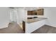 Modern kitchen featuring brown cabinets and granite countertops at 4561 Woolcomber St, Las Vegas, NV 89115