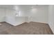 Bright living room space featuring neutral colored walls and carpet at 4561 Woolcomber St, Las Vegas, NV 89115