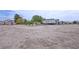 Expansive backyard with potential for customization, featuring a parked RV and a detached structure at 4830 E Comanche Dr, Pahrump, NV 89061