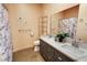 Bathroom with a double vanity, modern fixtures, and marble shower curtain at 4830 E Comanche Dr, Pahrump, NV 89061