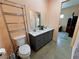 Bathroom with double sink vanity, contemporary style, and metal storage at 4830 E Comanche Dr, Pahrump, NV 89061