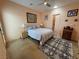 View of the bedroom with an area rug, artwork, and a warm inviting atmosphere at 4830 E Comanche Dr, Pahrump, NV 89061
