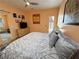 Cozy bedroom features art, exterior door, and a comfortable bed at 4830 E Comanche Dr, Pahrump, NV 89061