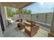 View of a covered patio, with wicker furniture, a heater, and exterior decorations at 4830 E Comanche Dr, Pahrump, NV 89061