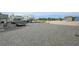 Wide shot of the property with a trailer, camper, and shed in the background at 4830 E Comanche Dr, Pahrump, NV 89061