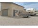 This home has an exterior door, a rolling garage door, and a camper parked on the property at 4830 E Comanche Dr, Pahrump, NV 89061