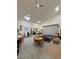 Expanded garage with lighting, dining area, and additional seating area at 4830 E Comanche Dr, Pahrump, NV 89061