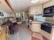 RV interior showcasing the living, kitchenette, and bedroom spaces in a compact layout at 4830 E Comanche Dr, Pahrump, NV 89061