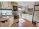 RV kitchenette featuring a sink, stove, microwave, and ample cabinet space at 4830 E Comanche Dr, Pahrump, NV 89061