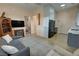 Open living space with a fireplace, TV, modern furniture, and seamless flow into the kitchen at 4830 E Comanche Dr, Pahrump, NV 89061