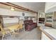 Interior RV living area with a cozy couch, table, and view into the bedroom at 4830 E Comanche Dr, Pahrump, NV 89061