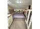 RV main bedroom with a comfortable bed, storage cabinets, and side tables at 4830 E Comanche Dr, Pahrump, NV 89061