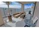 View of the patio area with a heat lamp, comfortable furniture, and grilling station at 4830 E Comanche Dr, Pahrump, NV 89061
