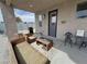 Cozy outdoor patio featuring comfortable wicker seating, a grill, and shade at 4830 E Comanche Dr, Pahrump, NV 89061