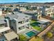 Aerial view of a modern home with a pool, patio, manicured backyard and neighborhood at 5231 Iron River Ct, Las Vegas, NV 89135