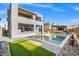 Stunning backyard with a pool, covered patio, and ample space for outdoor activities at 5231 Iron River Ct, Las Vegas, NV 89135