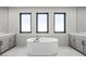 Modern bathroom with a soaking tub, double vanity, and plenty of natural light at 5231 Iron River Ct, Las Vegas, NV 89135