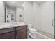 Bright bathroom with a glass-enclosed shower, a undermount sink, and a large mirror at 5231 Iron River Ct, Las Vegas, NV 89135