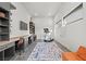 Well-lit bonus room with desk space, a treadmill, and a fun, decorative rug at 5231 Iron River Ct, Las Vegas, NV 89135