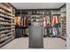 Spacious walk-in closet with custom shelving and ample storage for clothing and shoes at 5231 Iron River Ct, Las Vegas, NV 89135
