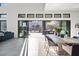 Open dining area with sliding glass doors, modern table set, and bright natural light at 5231 Iron River Ct, Las Vegas, NV 89135