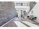 Grand entryway with soaring ceilings, stone accent wall, staircase, and stylish decor at 5231 Iron River Ct, Las Vegas, NV 89135