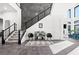 Elegant entryway with sleek staircase, modern furnishings, and stylish decor accents at 5231 Iron River Ct, Las Vegas, NV 89135