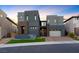 Modern two-story home with clean lines, a manicured lawn, and a stylish facade at 5231 Iron River Ct, Las Vegas, NV 89135