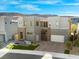 Contemporary two-story home featuring a modern design, desert landscaping and a brick driveway at 5231 Iron River Ct, Las Vegas, NV 89135
