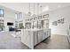 Open kitchen with large island, quartz countertops, and seamless access to living area at 5231 Iron River Ct, Las Vegas, NV 89135