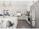 Modern kitchen with a quartz countertop, stainless steel appliances and stylish cabinets at 5231 Iron River Ct, Las Vegas, NV 89135