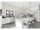 Bright kitchen with a large island, modern appliances, and stylish pendant lighting at 5231 Iron River Ct, Las Vegas, NV 89135