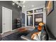 Open-concept living room featuring modern lighting, stylish decor, and large windows with natural light at 5231 Iron River Ct, Las Vegas, NV 89135