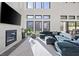 Modern living room with large windows, sleek fireplace, and comfortable, stylish seating at 5231 Iron River Ct, Las Vegas, NV 89135