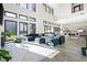 Spacious living room with high ceilings, large windows, and modern decor with tile floors at 5231 Iron River Ct, Las Vegas, NV 89135