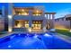 Backyard view with pool and the home's patio and upstairs balcony areas at 5231 Iron River Ct, Las Vegas, NV 89135