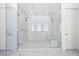 Luxurious walk-in shower featuring elegant marble tiles and dual shower heads at 5231 Iron River Ct, Las Vegas, NV 89135