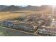 Wide aerial view showing a sprawling housing community, revealing its scale and design at 6144 Rathbone St, Las Vegas, NV 89166