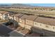 Inviting townhome community featuring modern architecture and convenient attached garages, complemented by landscaped front yards at 6144 Rathbone St, Las Vegas, NV 89166
