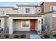 Charming townhome with a covered entryway, complemented by meticulously arranged rock landscaping at 6144 Rathbone St, Las Vegas, NV 89166