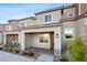 Inviting townhome facade with a covered entrance, neat landscaping, and a welcoming ambiance at 6144 Rathbone St, Las Vegas, NV 89166