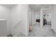 Upstairs hallway leading to multiple bedrooms and bathrooms at 6144 Rathbone St, Las Vegas, NV 89166